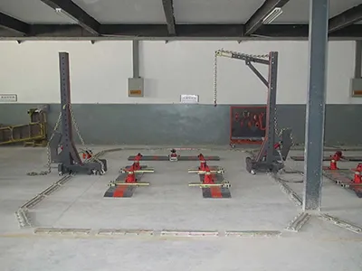 Sistema de enderezado de chasis con anclaje al suelo (sistema de tracción inferior)